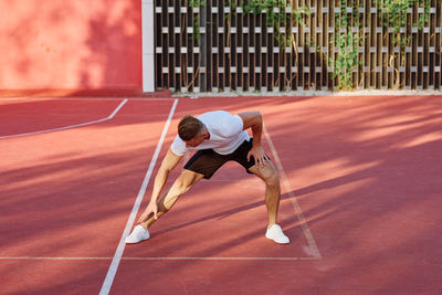 Rear view of man playing soccer