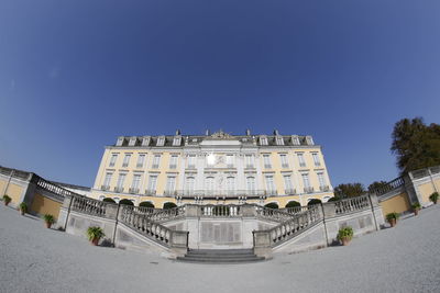 Low angle view of historical building against blue sky