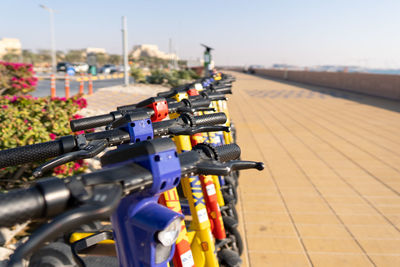 Close-up of bicycle parked on road in city