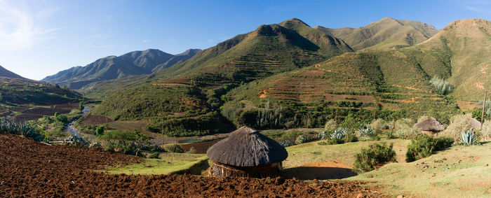 Scenic view of farm against sky