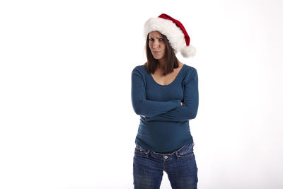 Portrait of beautiful young woman against white background