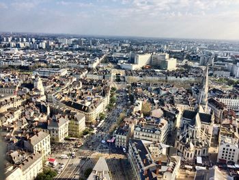 High angle view of buildings in city against sky