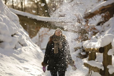 People on snow covered water during winter