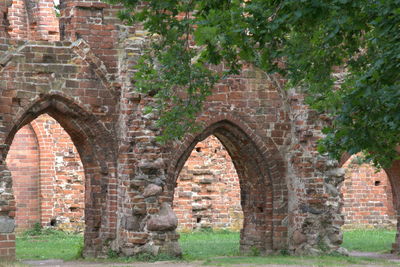 Old ruin against brick wall