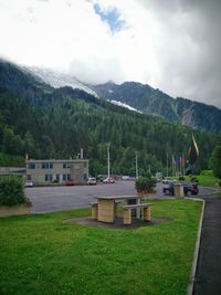 Scenic view of mountains against cloudy sky