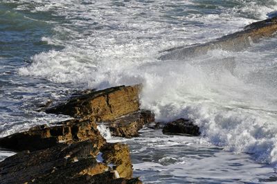 Waves splashing on rocks