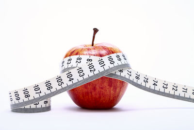 Close-up of apple against white background