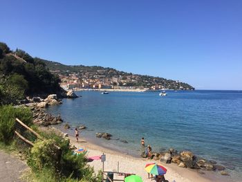 Scenic view of sea against clear blue sky