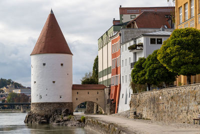 Historic tower used for salt trading at shore of river inn in passau, bavaria