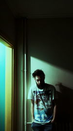 Young man standing in corridor