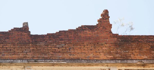 Low angle view of old ruins against clear sky