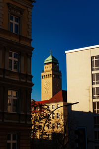 Low angle view of clock tower against sky