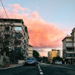 City street against cloudy sky