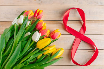 Bouquet of colorful tulips on a wooden background. concept for international women's day 