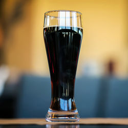 Close-up of beer glass on table