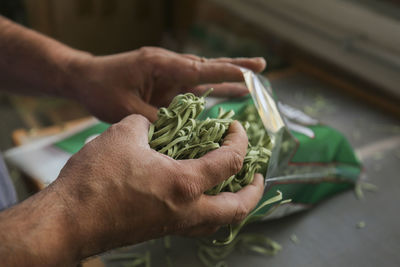 Close-up of man holding food