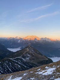 Scenic view of snowcapped mountains against sky