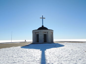 Church against clear blue sky during winter