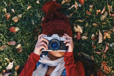 Portrait of woman photographing