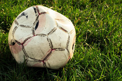 Close-up of soccer ball on field