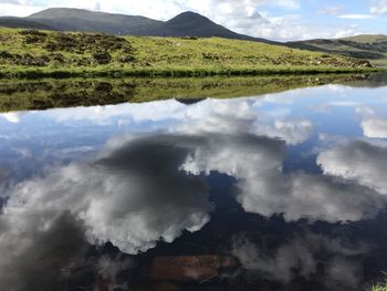 Scenic view of landscape and mountains against sky