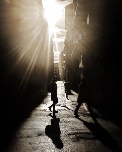 Sun shining through woman