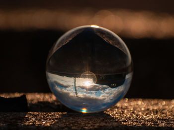 Close-up of crystal ball on table