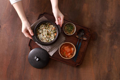 Cropped hands of person preparing food