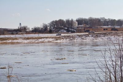 Scenic view of frozen lake against sky