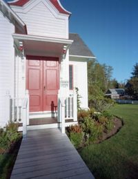 Exterior of house by building against sky