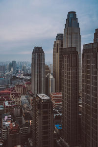 High angle view of buildings in city against sky