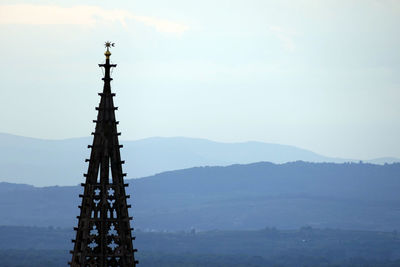 Built structure on landscape against sky