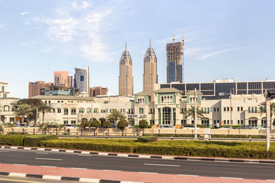 Buildings in city against sky