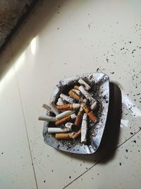 High angle view of cigarette in container