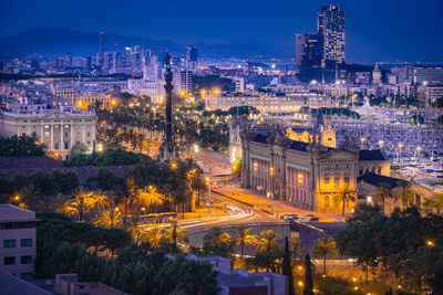 High angle view of city buildings at night