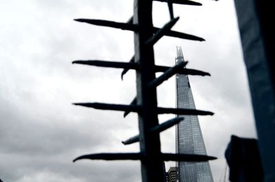 Low angle view of silhouette tower against sky