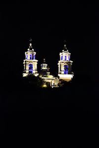 Low angle view of illuminated church at night