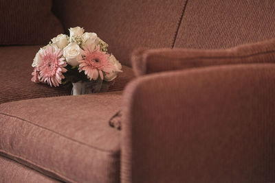 Flower bouquet on sofa at home