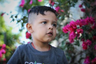 Close-up portrait of cute boy looking away