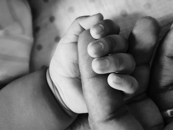 Close-up of baby feet on bed