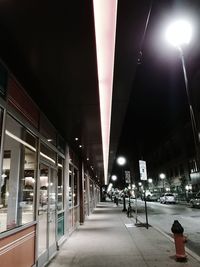 View of illuminated street at night