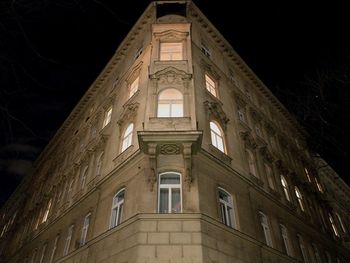 Low angle view of illuminated building at night