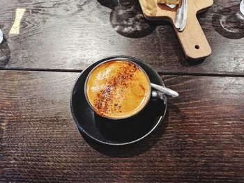 High angle view of coffee cup on table