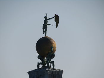 Low angle view of statue against clear sky