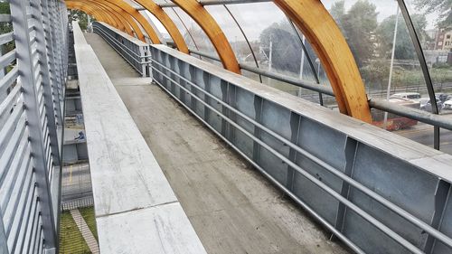 Cars on railing against sky