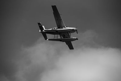 Low angle view of seaplane against sky