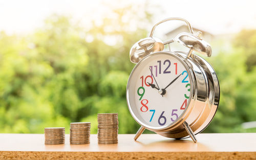 Close-up of clock on table