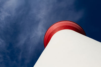 Low angle view of electric lamp against sky