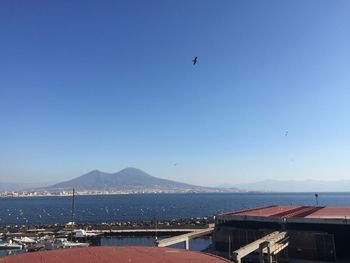 Scenic view of mountains against clear blue sky