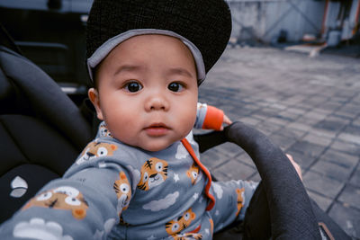 My first son when we take a afternoon walk on the street with stroller.